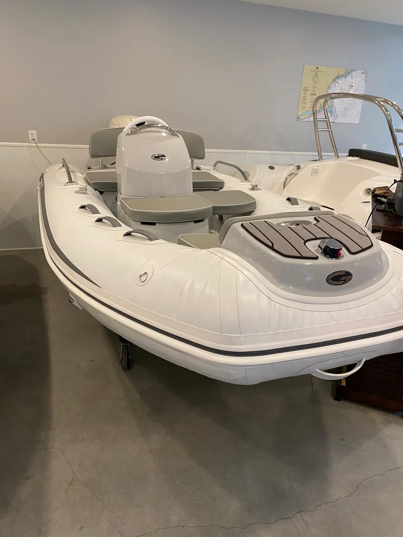 Slide: The Image of 2022 Grand G380 inflatable boat in showroom, featuring sleek design and modern amenities. - 2