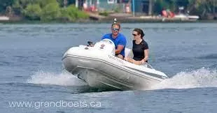 Slide: The Image of Two people riding a 2022 Grand G380 inflatable boat on a lake. - 6