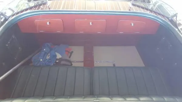 Slide: The Image of 1989 Hacker-Craft Triple Cockpit interior with leather seats and wooden accents. - 15