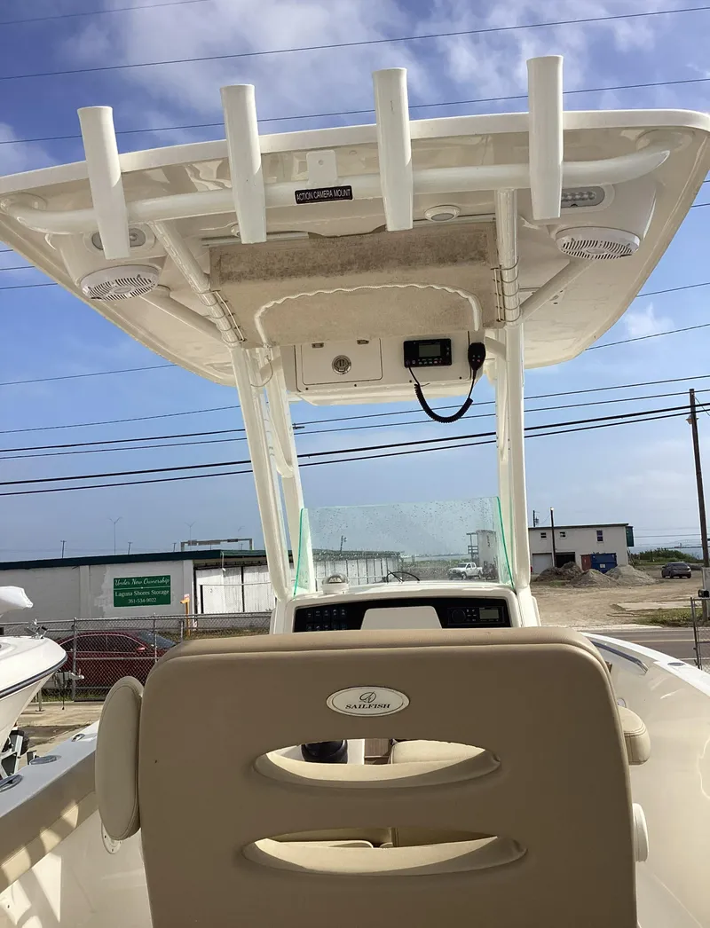 Slide: The Image of 2021 Sailfish 241CC boat interior with T-top and helm station. - 4