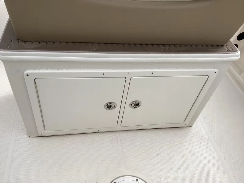 Slide: The Image of Storage compartment on 2021 Sailfish 241CC boat deck. - 7