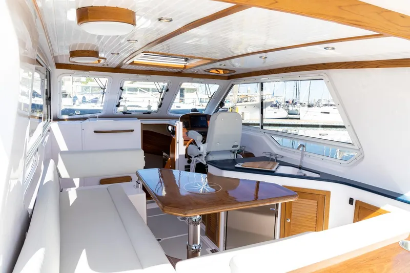 Slide: The Image of Luxurious interior of 2020 True North 34 yacht with elegant wood finishes and spacious seating. - 15