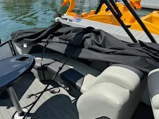 Slide: The Image of 2021 SunChaser Geneva Sport 22 LR DH boat interior with seating and table. - 11