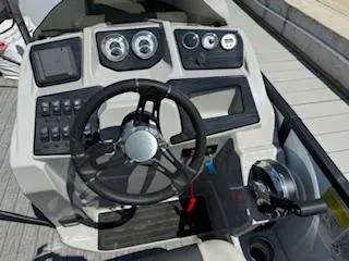 Slide: The Image of Dashboard of 2021 SunChaser Geneva Sport 22 LR DH boat with steering wheel and controls. - 5