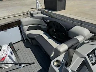 Slide: The Image of Interior of 2021 SunChaser Geneva Sport 22 LR DH pontoon boat with seating and steering wheel. - 7