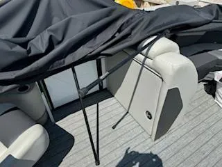 Slide: The Image of 2021 SunChaser Geneva Sport 22 LR DH boat interior with covered seating area. - 9