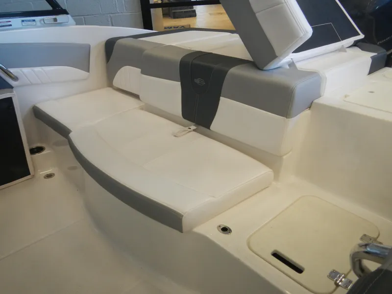 Slide: The Image of Interior seating of 2024 Chaparral 21 SSi boat with white and gray upholstery. - 5