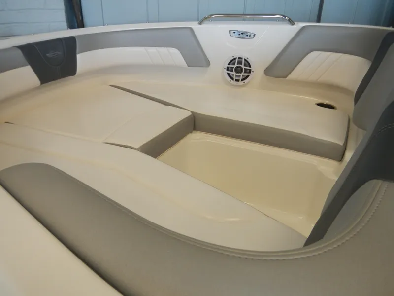 Slide: The Image of 2024 Chaparral 21 SSi boat interior with cushioned seating and speaker system. - 6