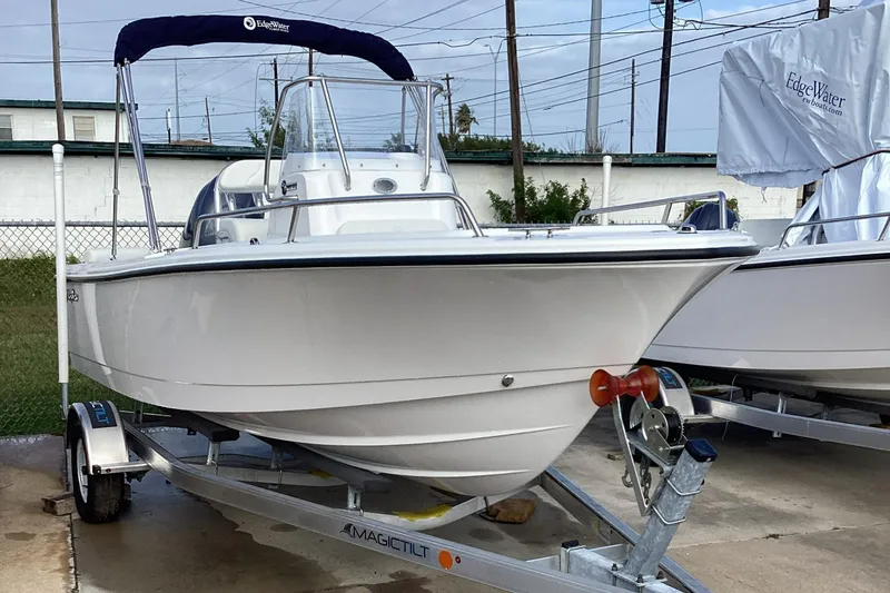 Slide: The Image of 2023 Edgewater 188CC boat on a trailer, ready for transport. - 1