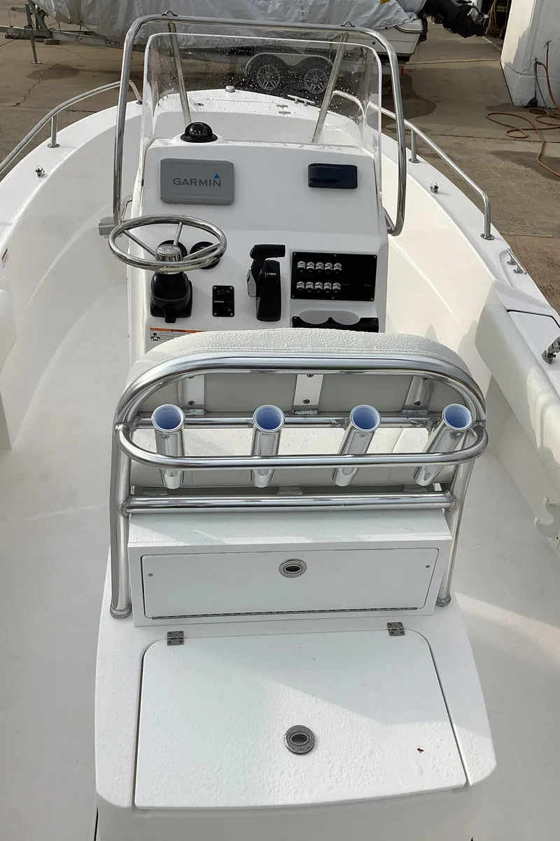 Slide: The Image of 2023 Edgewater 188CC center console boat with rod holders and storage compartments. - 3