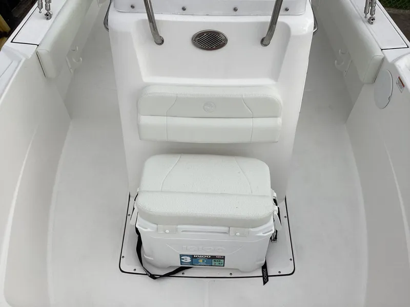 Slide: The Image of 2023 Edgewater 188CC boat interior with seating and cooler. - 6