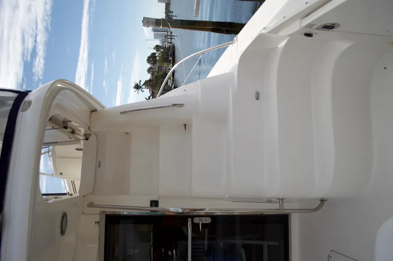 Slide: The Image of 2005 Sea Ray 550 Sedan Bridge yacht stairs and deck area. - 13