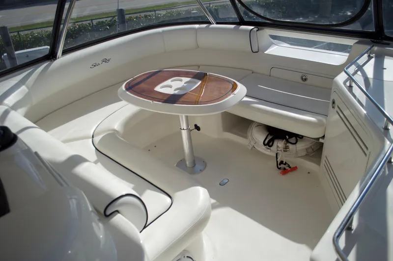 Slide: The Image of 2005 Sea Ray 550 Sedan Bridge interior seating area with table. - 17