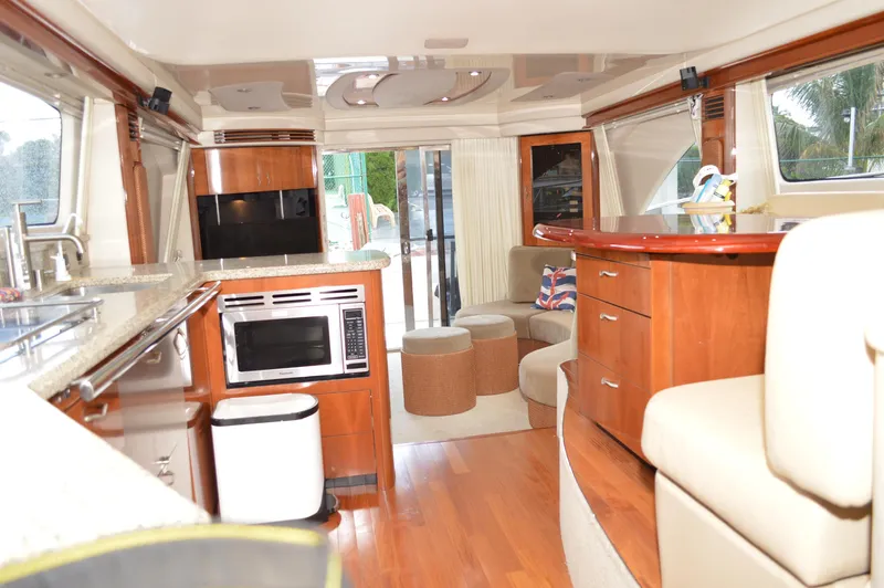 Slide: The Image of Luxurious interior of a 2005 Sea Ray 550 Sedan Bridge yacht with modern amenities. - 5
