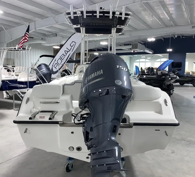 Slide: The Image of 2024 Key West 203 FS boat with Yamaha 150 outboard motor in showroom. - 3