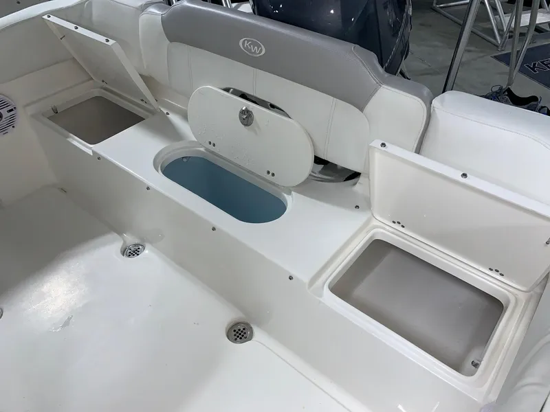 Slide: The Image of 2024 Key West 203 FS boat interior with storage compartments and seating. - 7
