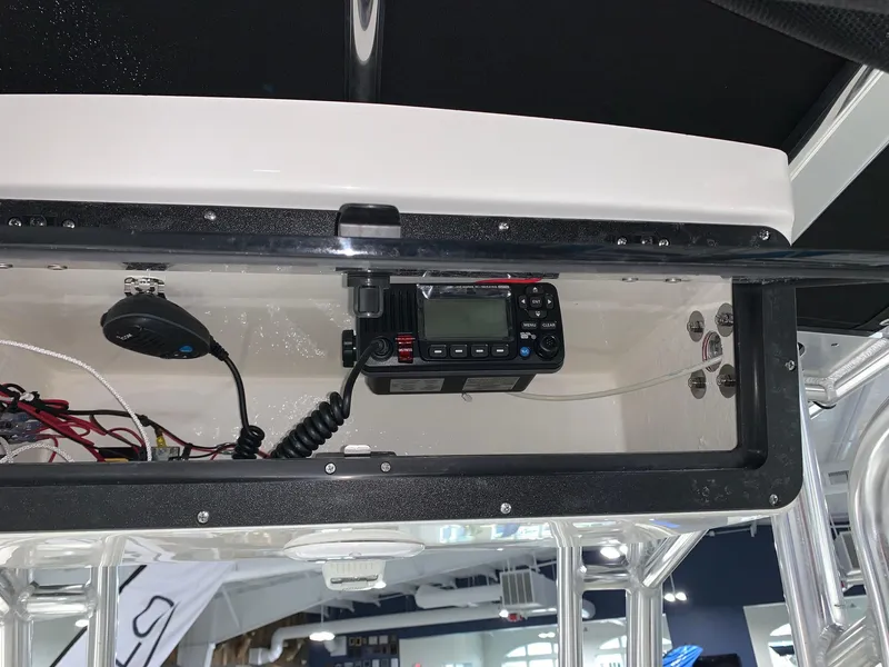 Slide: The Image of 2024 Key West 203 FS boat console with mounted radio equipment. - 9