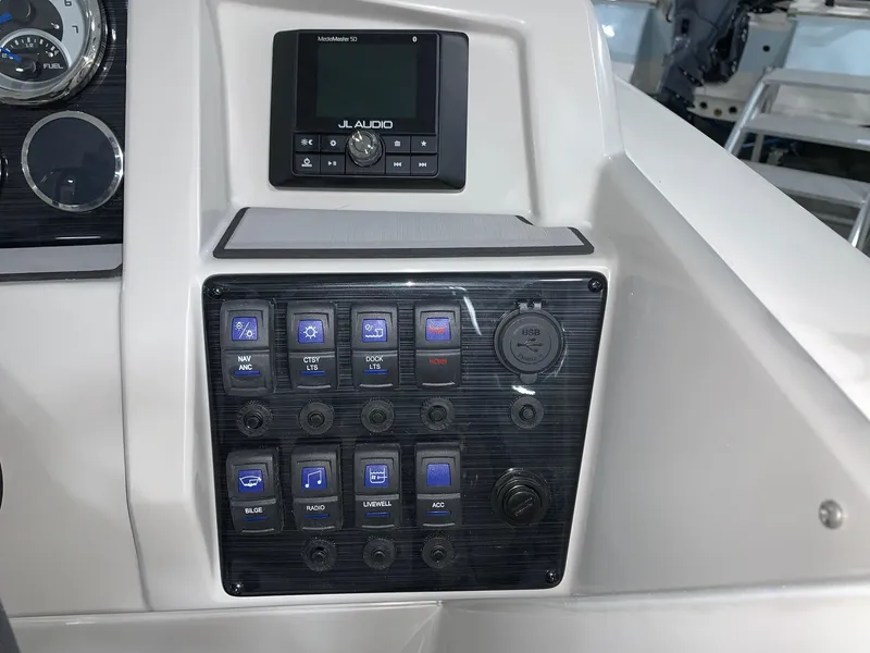 Slide: The Image of Control panel of 2024 Starcraft SVX 211 boat with JL Audio system. - 11