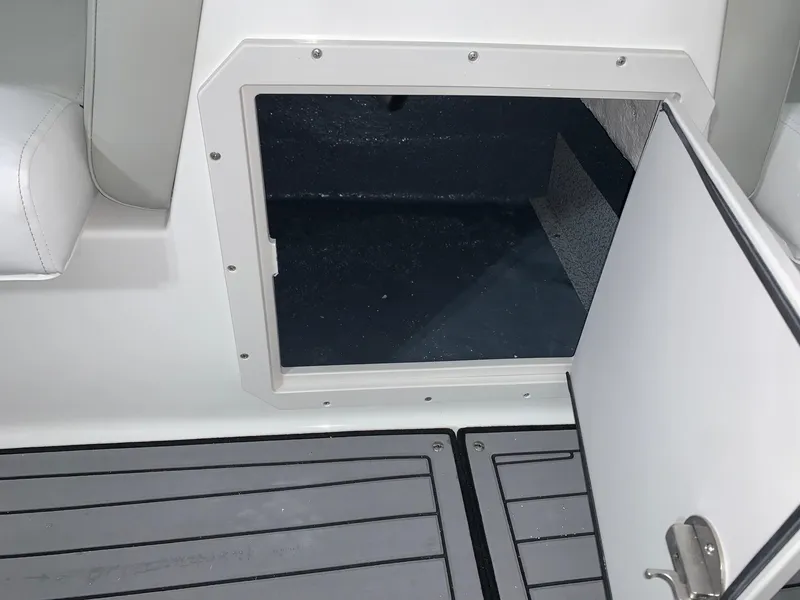 Slide: The Image of Open storage compartment on 2024 Starcraft SVX 211 boat. - 14