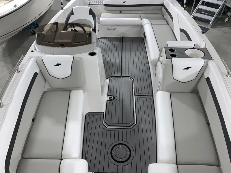Slide: The Image of 2024 Starcraft SVX 211 boat interior with gray and white seating and flooring. - 18