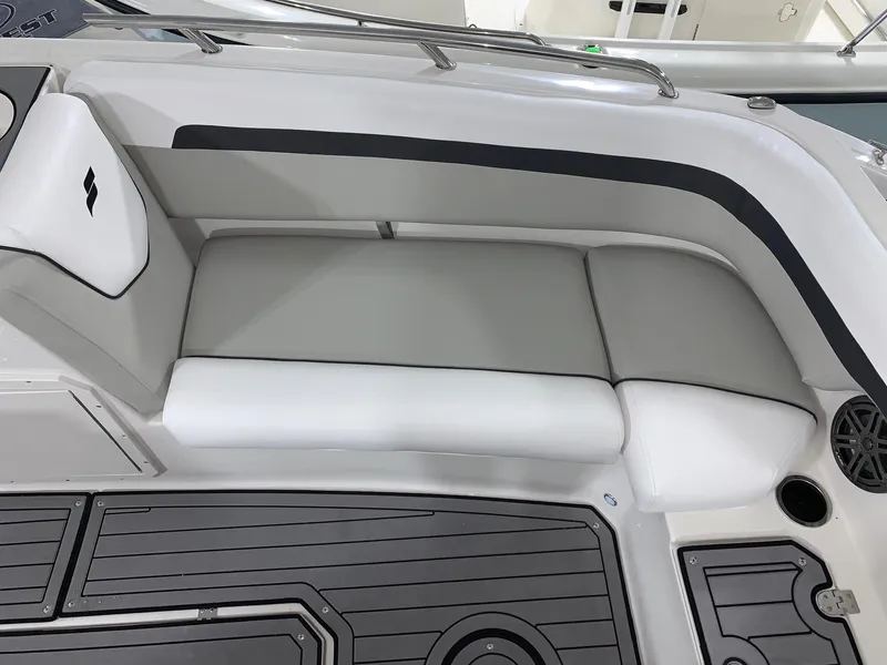 Slide: The Image of 2024 Starcraft SVX 211 boat interior seating with gray and white upholstery. - 19
