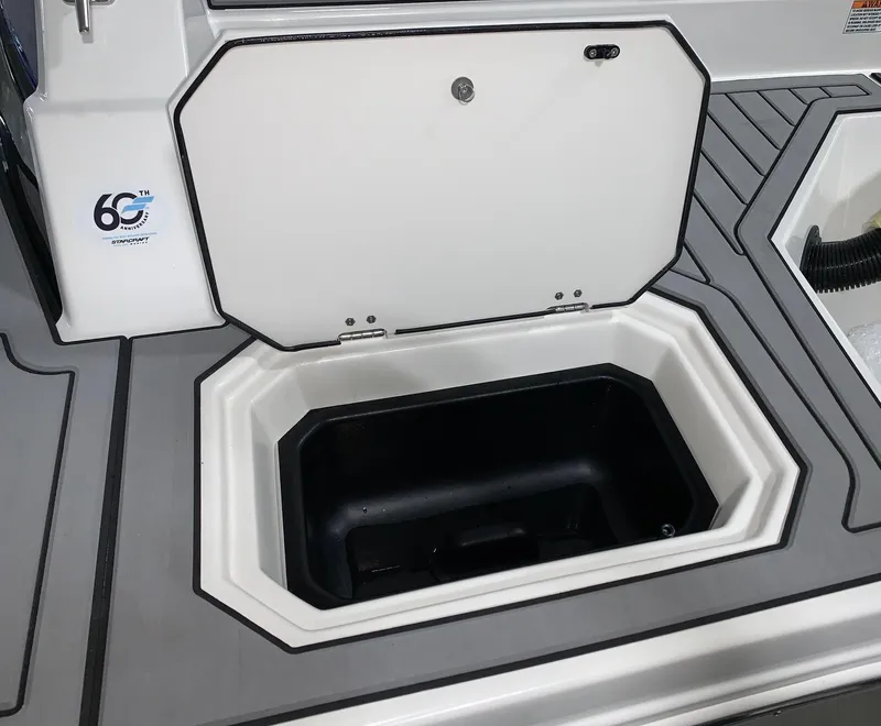 Slide: The Image of 2024 Starcraft SVX 211 boat storage compartment with open hatch. - 7