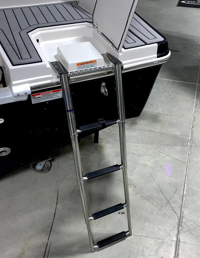 Slide: The Image of 2024 Starcraft SVX 211 boat with extended swim ladder. - 9