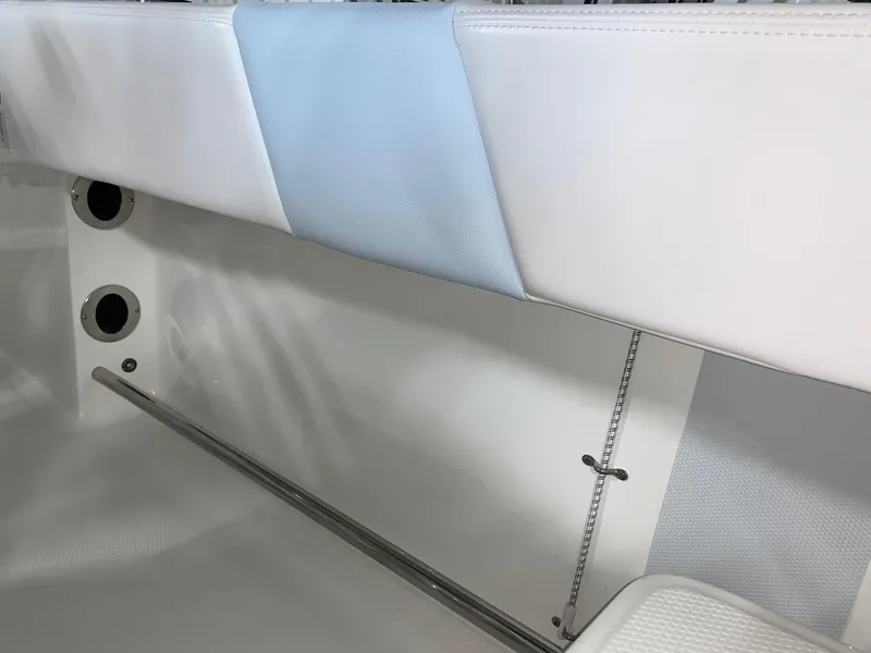 Slide: The Image of 2024 Robalo R202 Explorer interior seating detail with white and blue upholstery. - 19