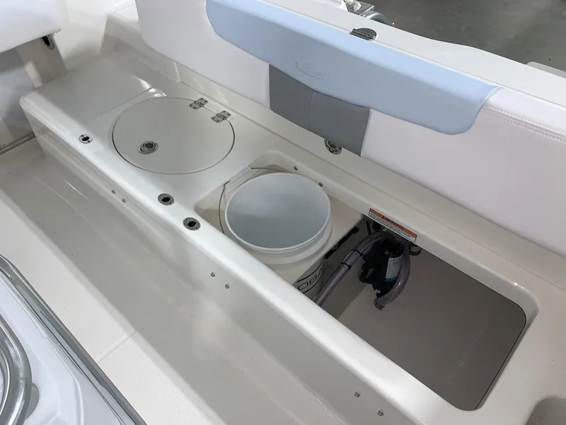 Slide: The Image of 2024 Robalo R202 Explorer boat storage compartments and seating area. - 22