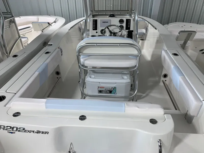 Slide: The Image of 2024 Robalo R202 Explorer boat interior with helm and seating. - 24