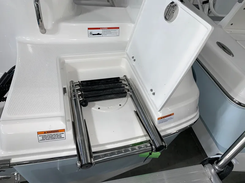 Slide: The Image of 2024 Robalo R202 Explorer boat with foldable swim ladder. - 3