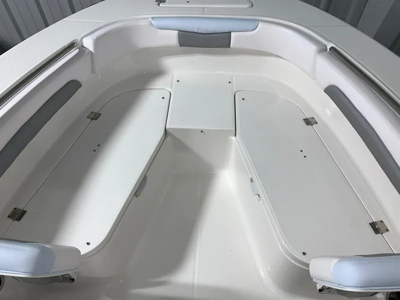 Slide: The Image of 2024 Robalo R202 Explorer boat interior seating and storage compartments. - 8