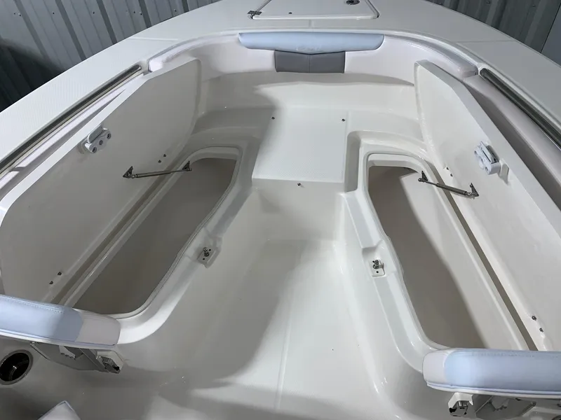 Slide: The Image of 2024 Robalo R202 Explorer boat storage compartments. - 10