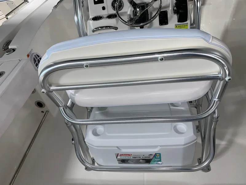 Slide: The Image of 2024 Robalo R202 Explorer boat interior with stainless steel frame and cooler. - 20