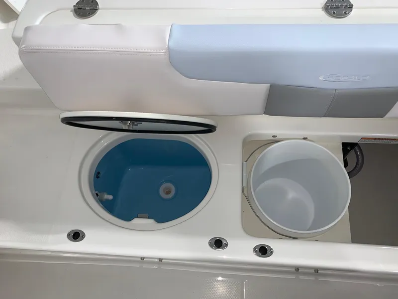 Slide: The Image of 2024 Robalo R202 Explorer boat storage compartments and seating. - 23