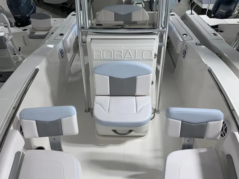 Slide: The Image of 2024 Robalo R202 Explorer boat interior with seating and console. - 5