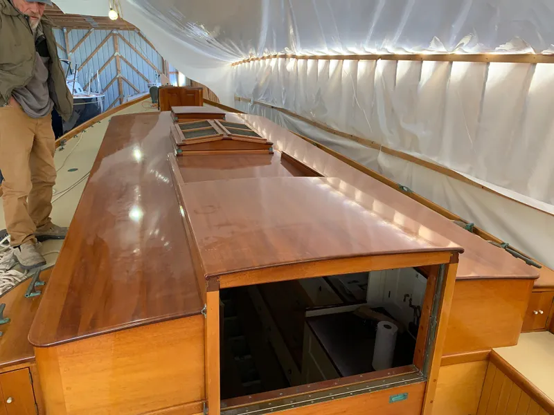 Slide: The Image of Restored 1902 Herreshoff Gaff Cutter interior with polished wood finish. - 13