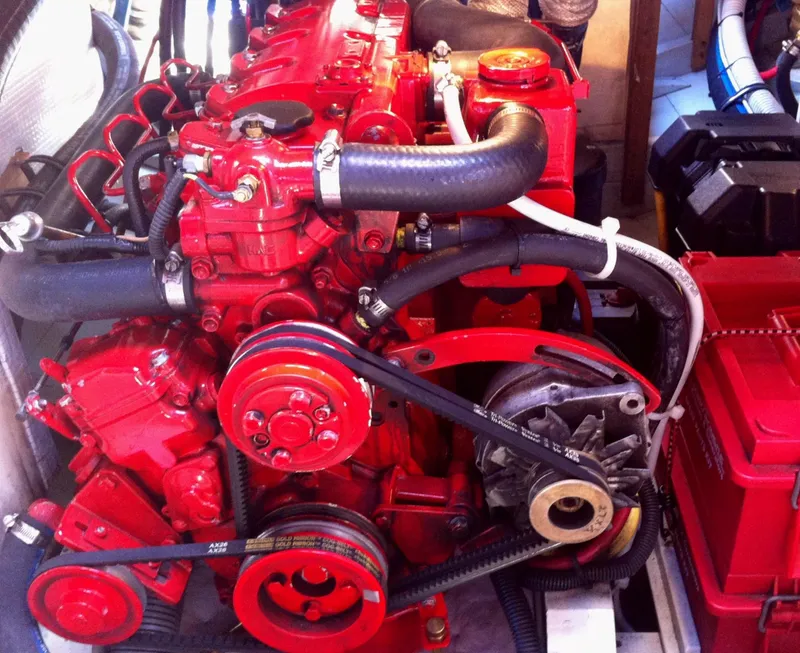 Slide: The Image of Red engine of a 1902 Herreshoff Gaff Cutter, showcasing intricate mechanical details. - 29
