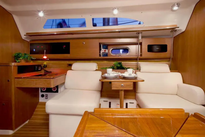 Slide: The Image of Luxurious interior of 2025 Catalina 356 yacht with elegant seating and wooden finishes. - 10