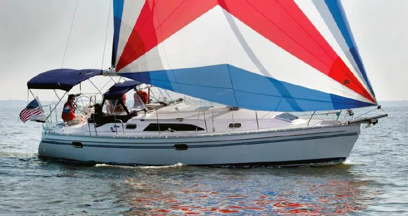 Slide: The Image of 2025 Catalina 356 sailboat with colorful sails on open water. - 3