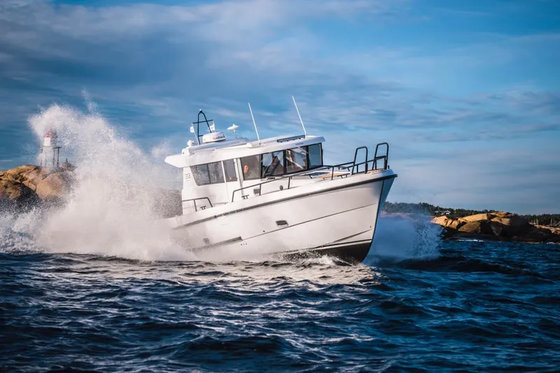 Slide: The Image of 2025 Sargo 33 boat navigating rough seas with splashing waves. - 2