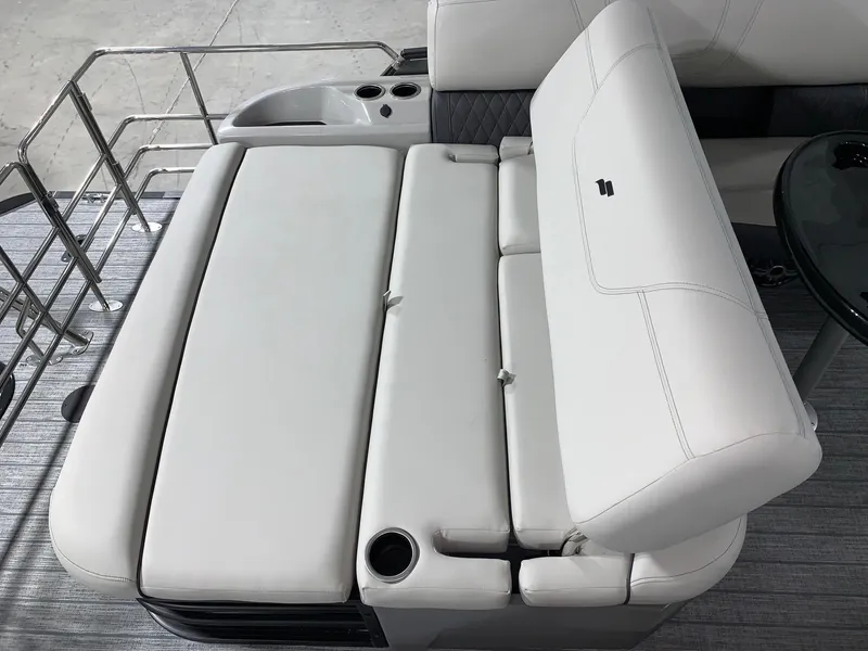 Slide: The Image of 2024 Starcraft SLS 3 Q DH boat interior seating with cup holders. - 6