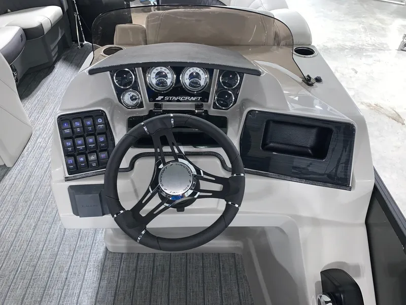 Slide: The Image of 2024 Starcraft SLS 3 Q DH boat dashboard with steering wheel and control panel. - 8