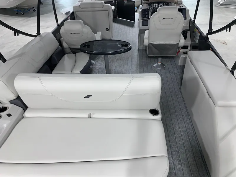 Slide: The Image of 2024 Starcraft SLS 3 Q DH boat interior with white seating and modern dashboard. - 5