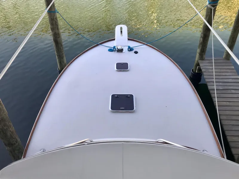 Slide: The Image of 1993 Gamefisherman 34 Express boat docked, top view of the bow. - 2