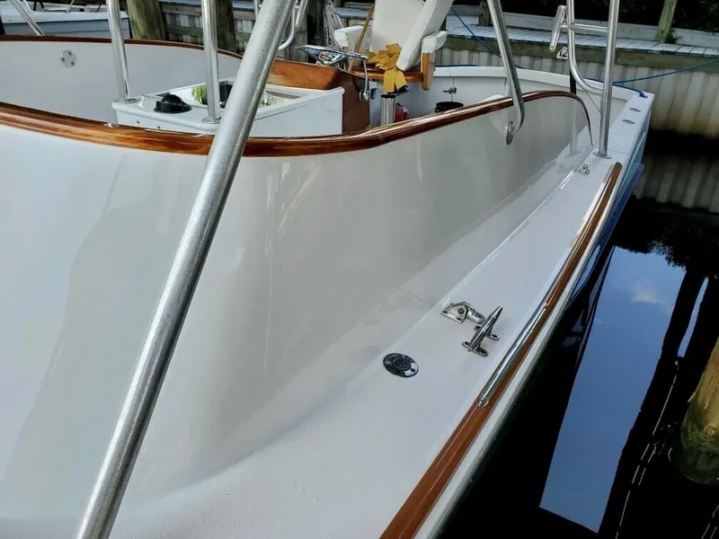 Slide: The Image of 1993 Gamefisherman 34 Express boat with polished deck and wooden trim. - 3