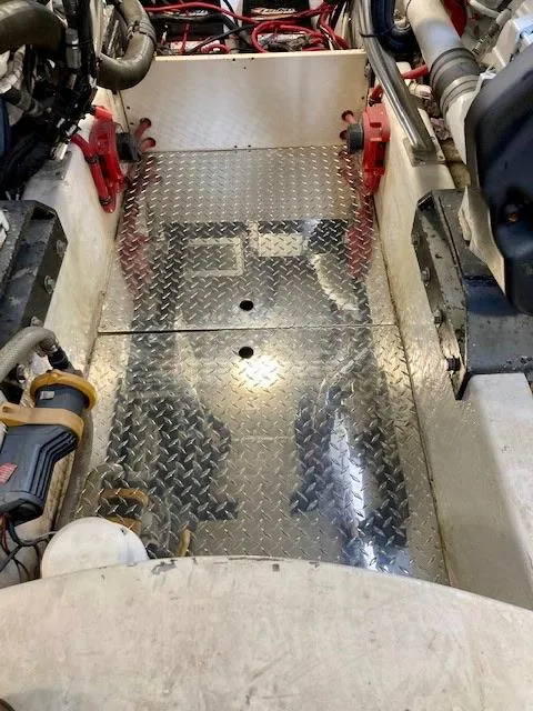 Slide: The Image of 1993 Gamefisherman 34 Express engine room with diamond plate flooring. - 7