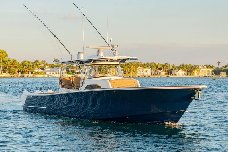 Slide: The Image of 2025 Valhalla Boatworks V-46 cruising on water at sunset. - 2