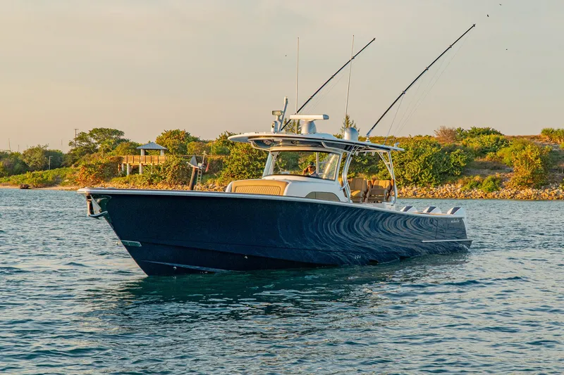 Slide: The Image of 2025 Valhalla Boatworks V-46 cruising on a scenic waterway. - 6