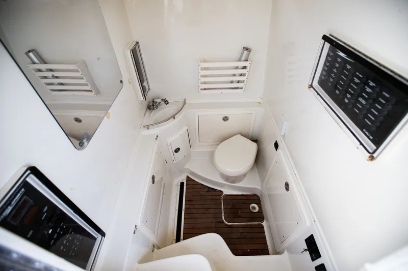 Slide: The Image of Interior of 2013 Hydra-Sports 42 Siesta boat bathroom with toilet and sink. - 14